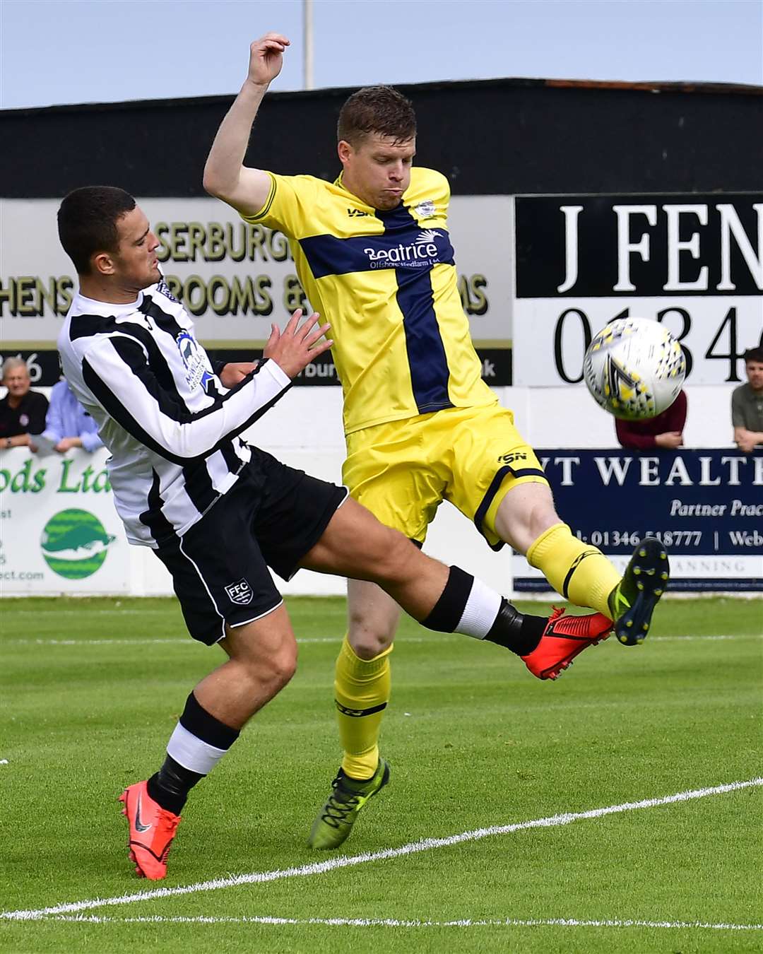 Ross Allan of Wick Academy clears the ball ahead of Fraserburgh's Scott Barbour. Picture: Mel Roger