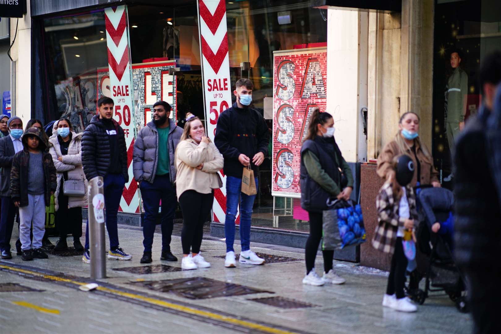 Shoppers in masks on Boxing Day (Ben Birchall/PA)
