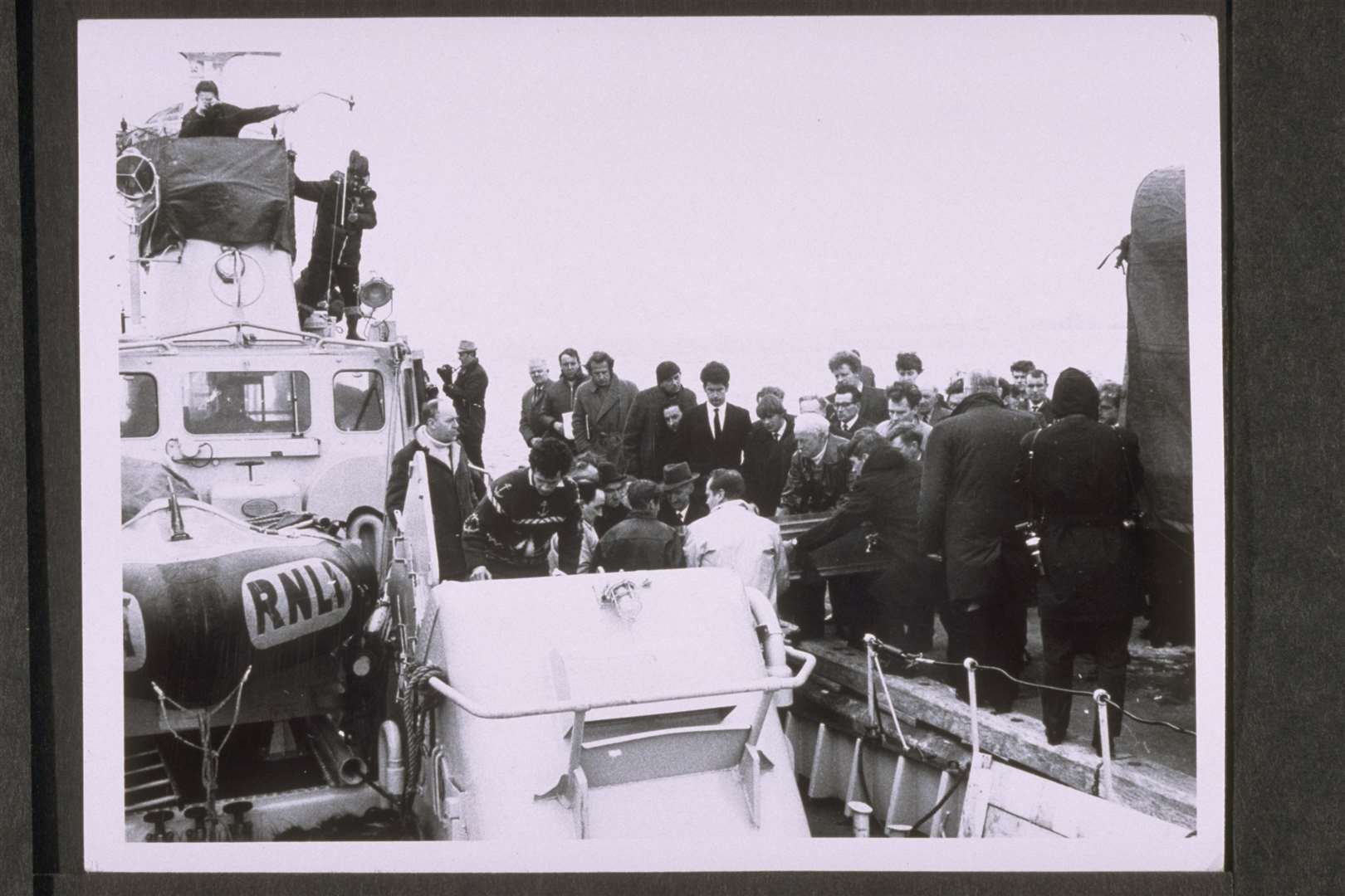 Coffins with the seven crew of the Longhope lifeboat being ferried to the graveyard on the Orkney island of Walls in 1969. Picture: RNLI