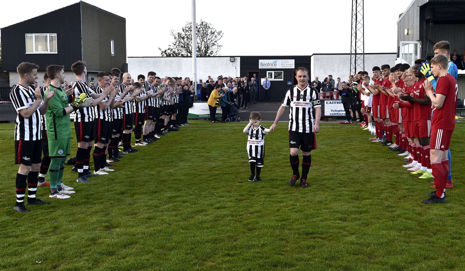 Guard of honour for Richard Macadie from the Wick Academy and Aberdeen teams. Picture: Bob Roger