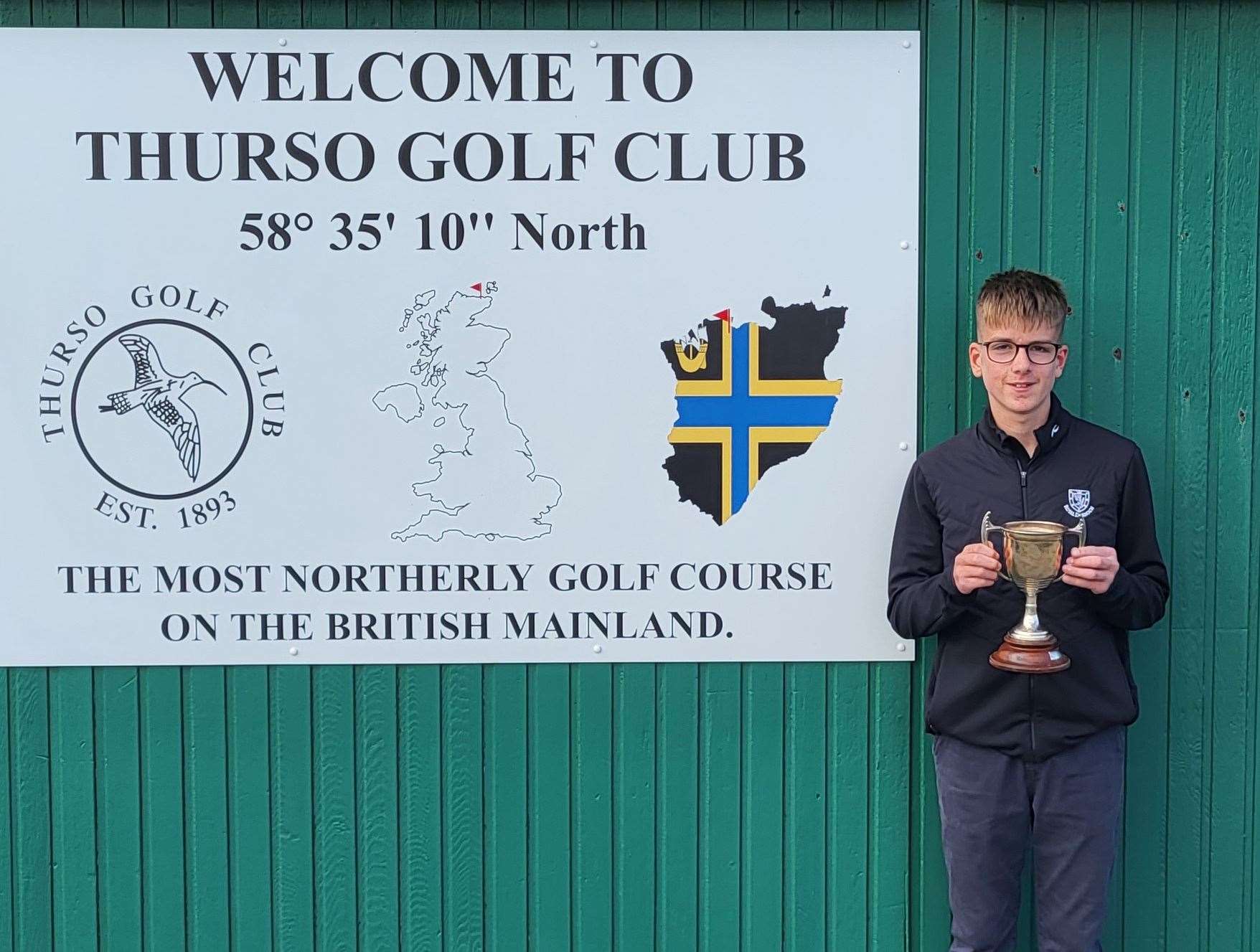 Tyler Gordon at Thurso Golf Club after receiving the county championship trophy.