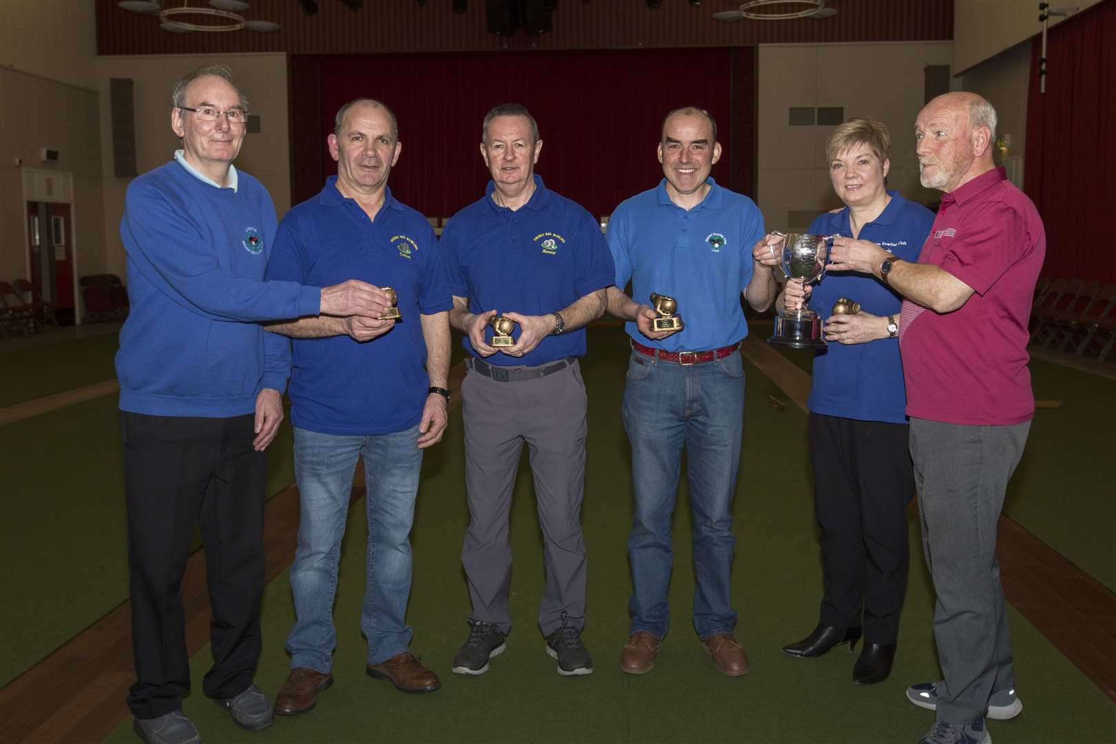 Association president David Mackay (right) is pictured presenting Liam Swanson and Linda Mackay with their trophy, while association secretary George Falconer (left) hands over the runner-up trophies to Calum Elder (second left) and Kenny McLeod. Picture: Robert MacDonald / Northern Studios