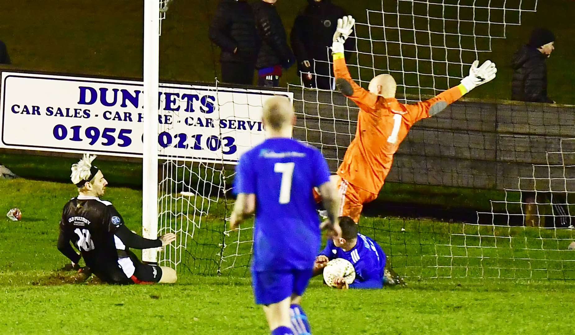 A net-bound effort by Liam Bremner is stopped on the line by Lossiemouth's Ross Archibald, but no penalty was given. Picture: Mel Roger