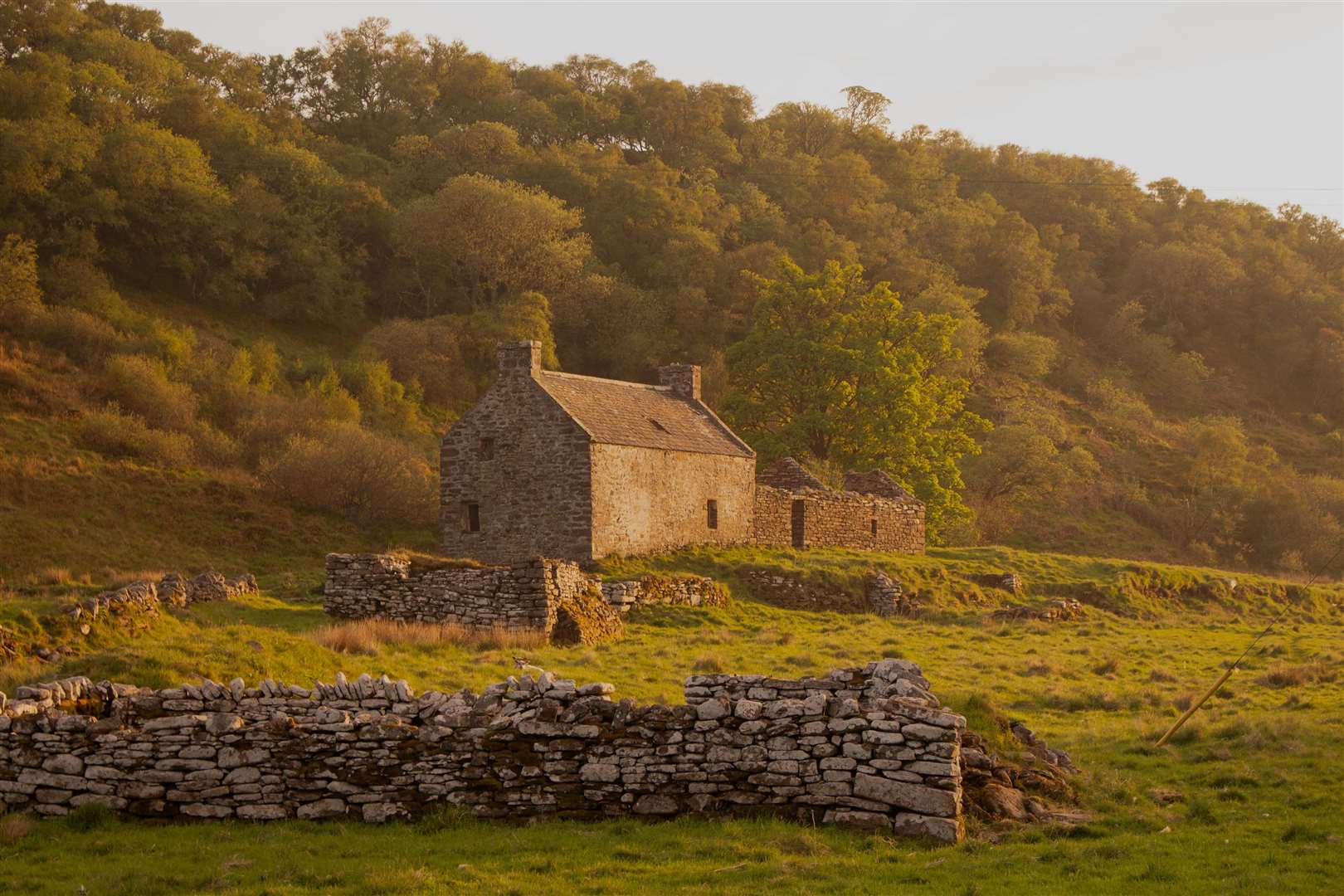The Old Milton Inn at Dunbeath bathed in evening sunlight, pictured by John Davidson.
