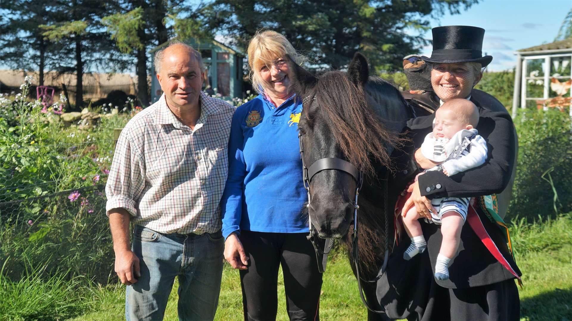 Daren and Caroline Ivey with their daughter Gabriella and her baby Tommy beside 20-year-old Jerry the horse who competed at the Blair Castle International Horse Trials. Picture: DGS