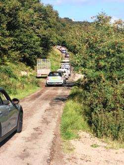 A slow moving convoy of Minis.
