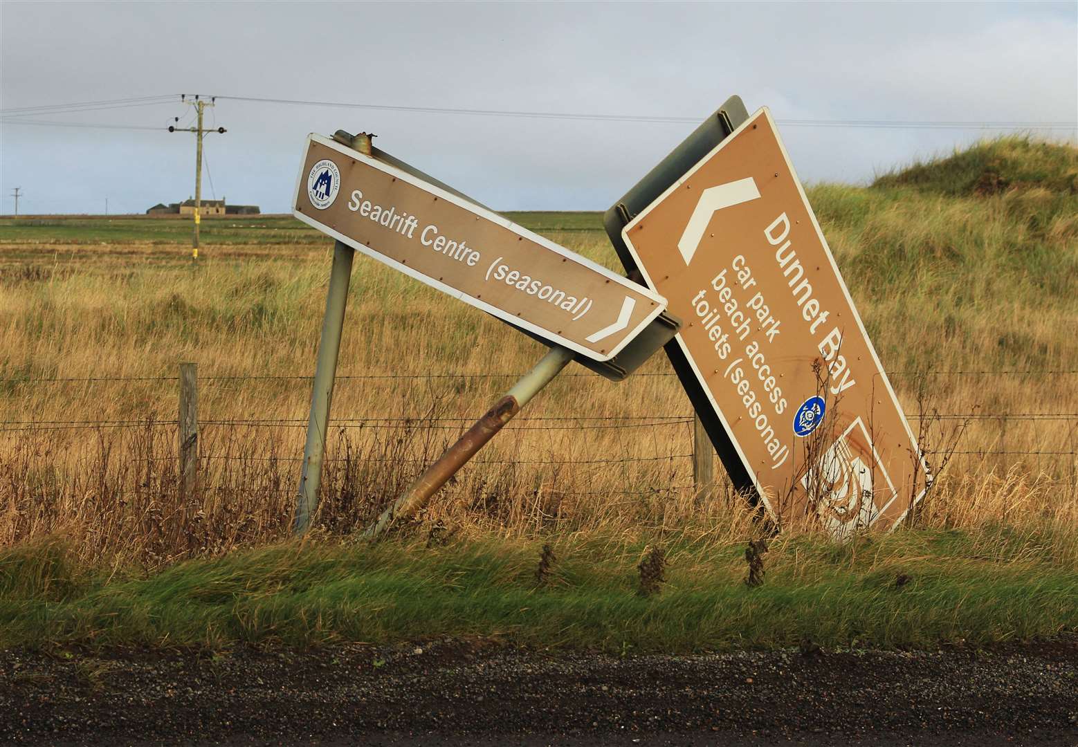 The pair of road signs, one of which has fallen over completely, on the North Coast 500 at Dunnet Bay. Picture: Alan Hendry