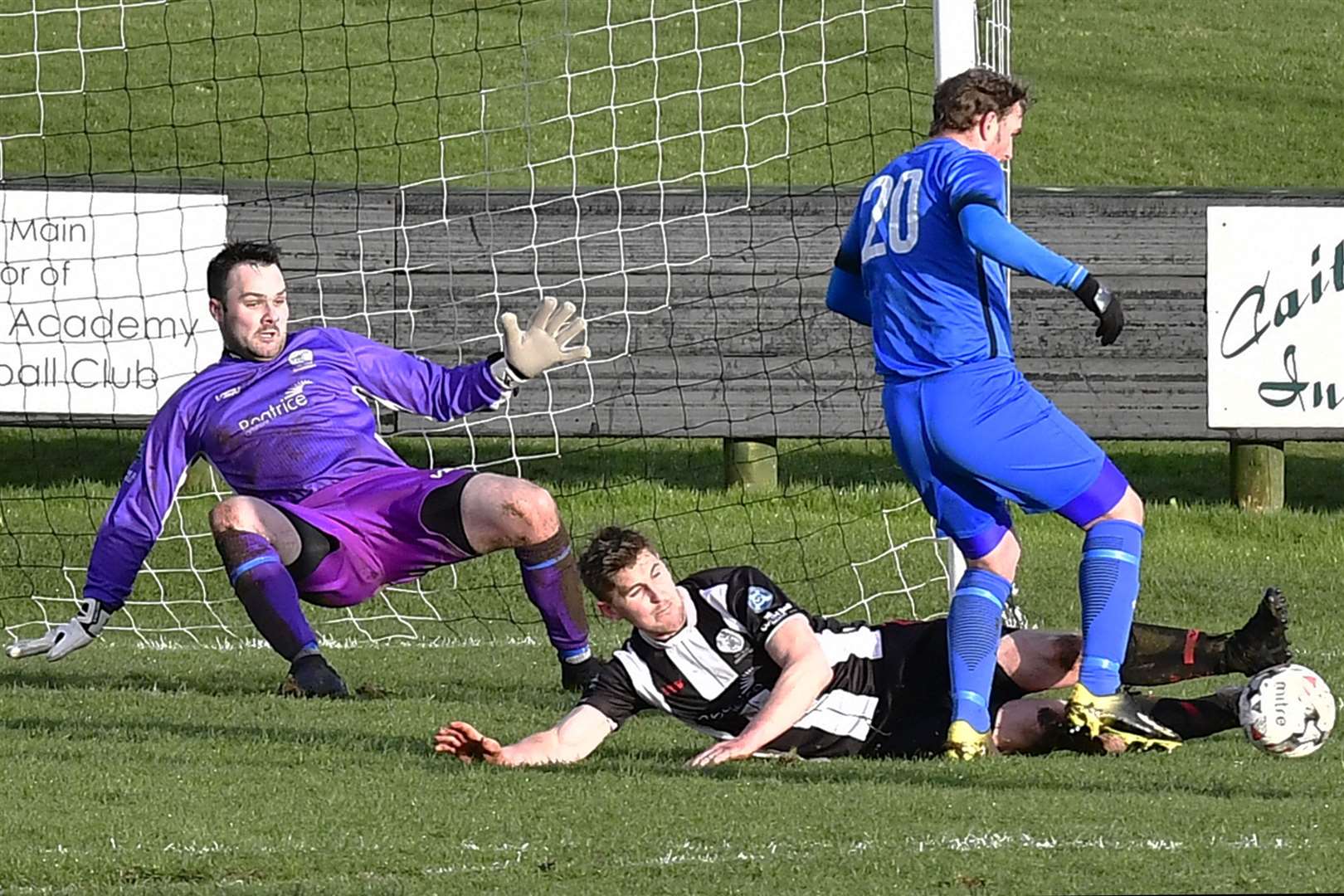 Steven is renowned for his committed style and here he is at full stretch to knock the ball away from Strathspey Thistle's Craig MacMillan in a league match at Harmsworth Park in 2019. Picture: Mel Roger