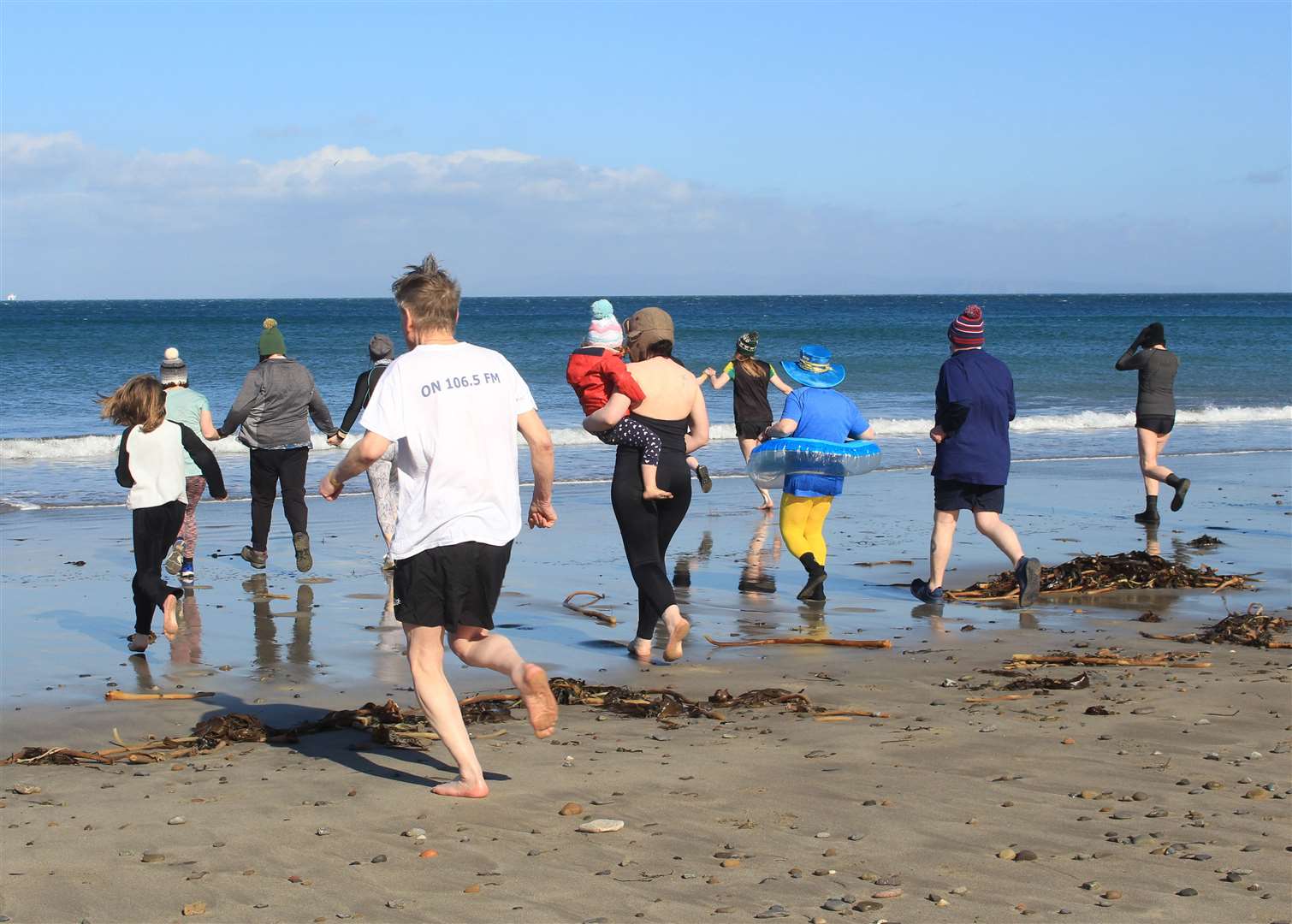 Intrepid swimmers heading to the sea for Thurso's first Spring Soakin’ event. Picture: Alan Hendry