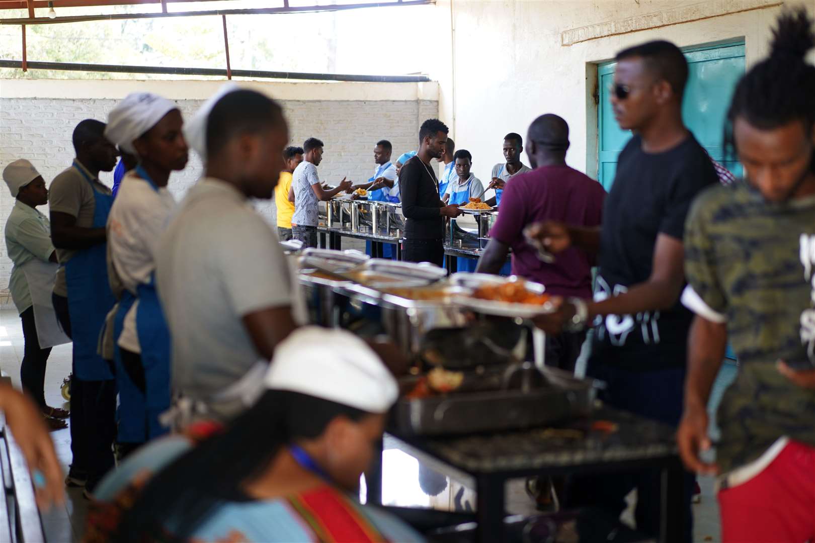 Residents are served food in the canteen (Victoria Jones/PA)
