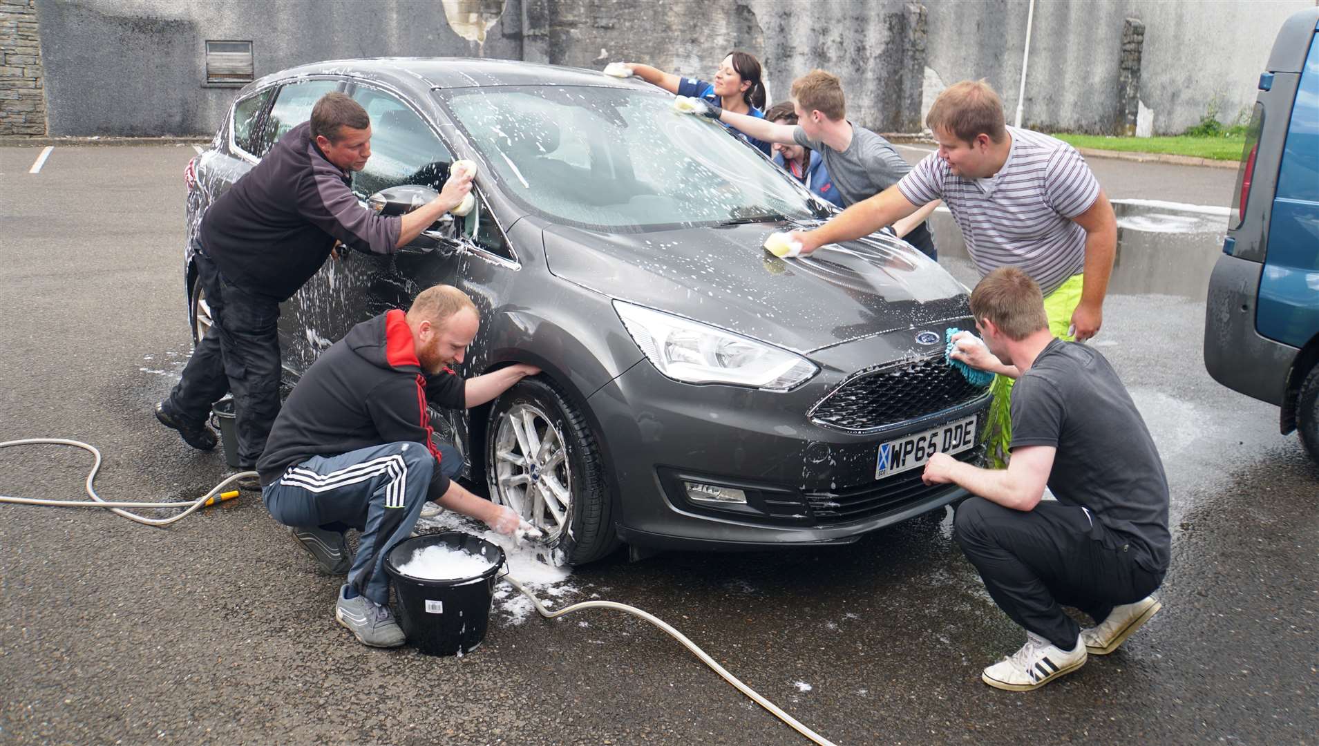 All hands on deck as the car wash crew get stuck in at Wick Coop on Sunday afternoon. Pictures: DGS