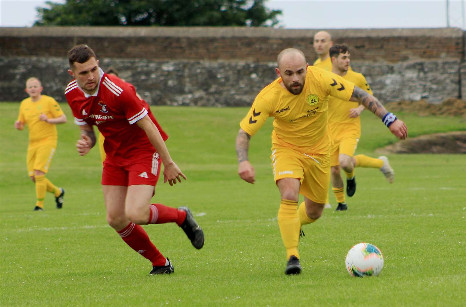 Martin Banks tries to break forward for Staxigoe United.
