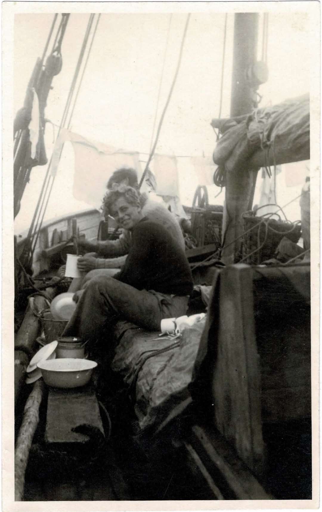A teenage Philip grins while washing up aboard the school vessel (Major B Varvill R.A.M.C/PA)