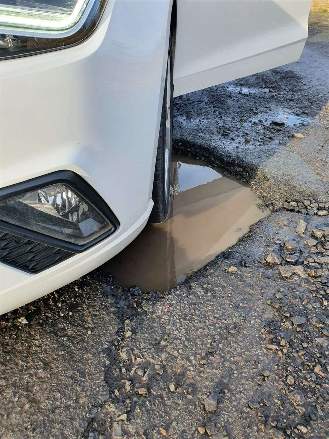 One of Gary Sinclair's front wheels in a pothole.