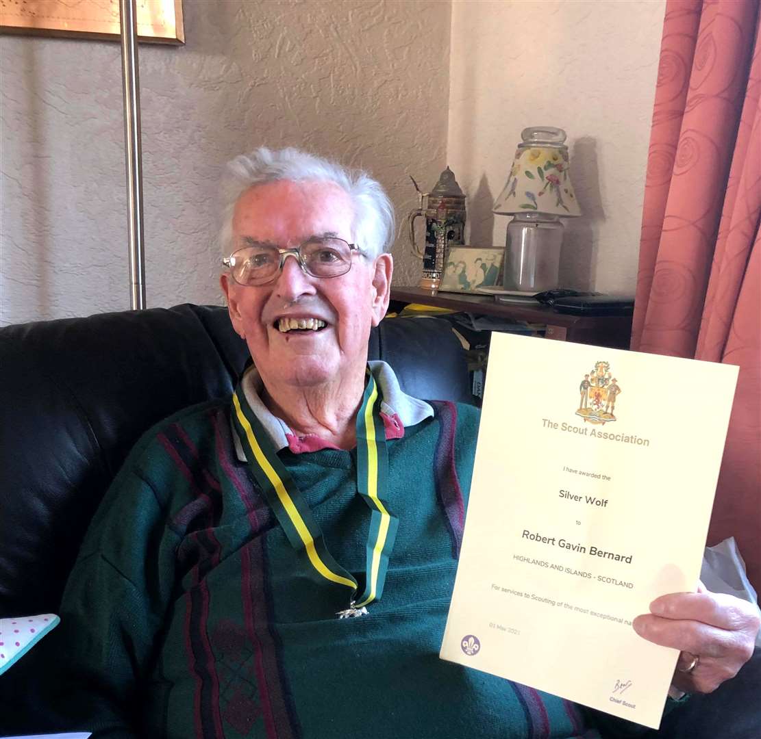 Gavin Bernard with his Silver Wolf medal and certificate.