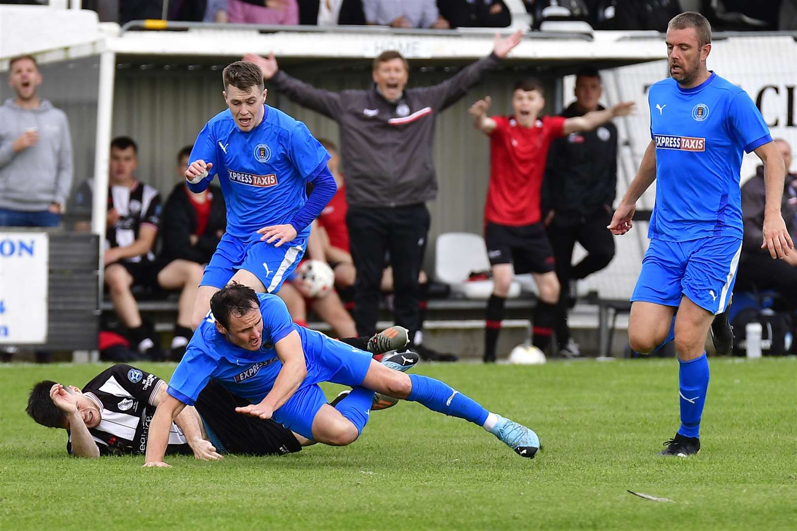 Wick substitute Sean Campbell is taken down by Jamie McCormack in the incident that led to the Bo'ness United defender being sent off. Picture: Mel Roger