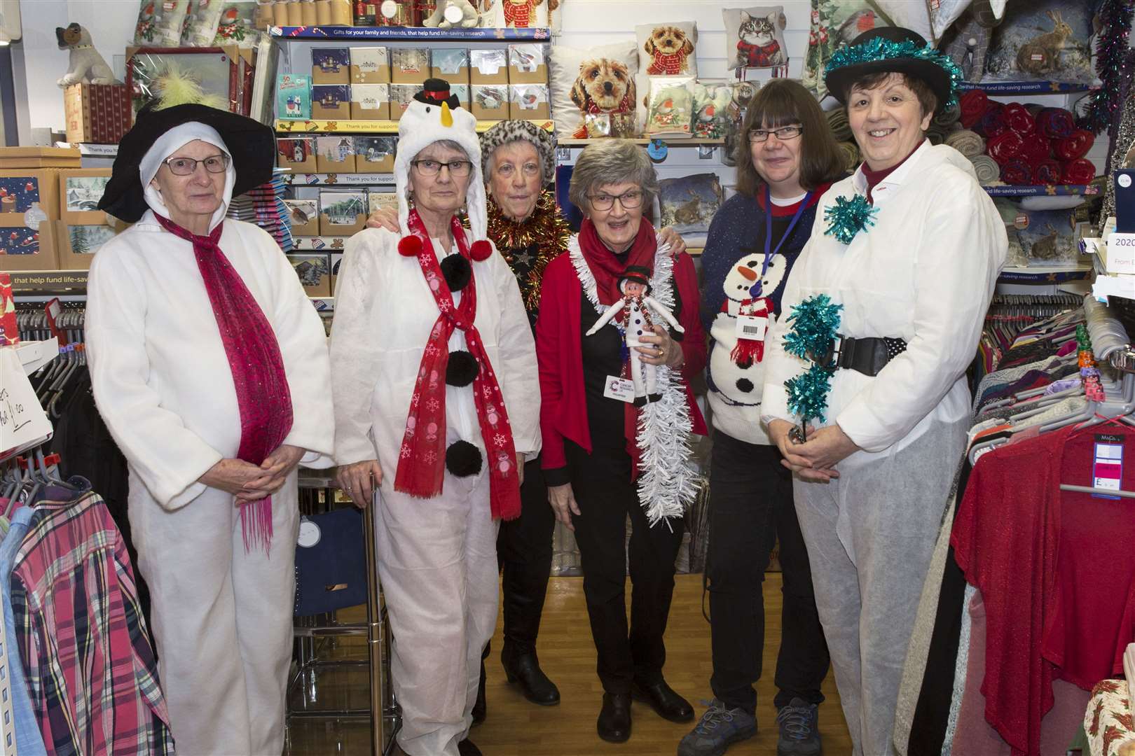 Cancer Research UK shop manager Sheila Gunn (right) with volunteer staff (from left) Elsa Swanson, Jean Campbell, Betty Cunningham, Gena Mackenzie and Mandy Bartlett. Picture: Robert MacDonald / Northern Studios