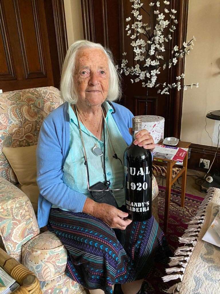 Elizabeth Christina McDonald with a magnum of Madeira wine from the year she was born.