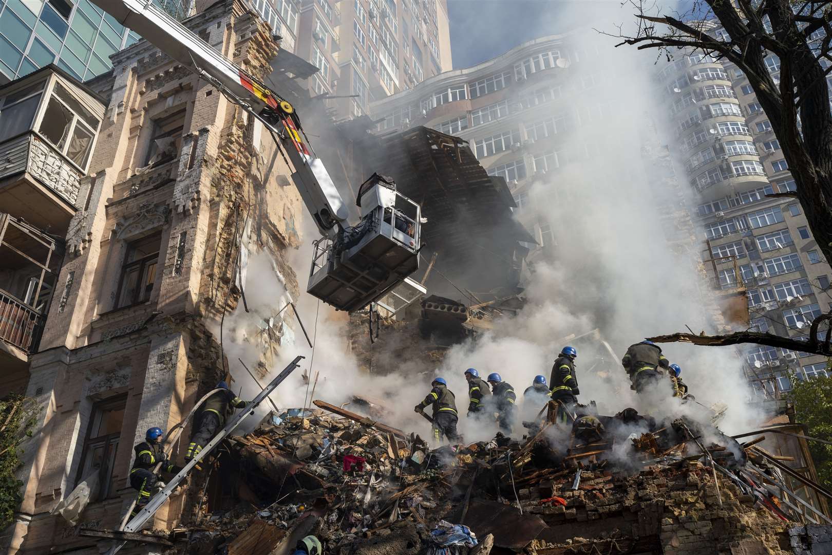 Firefighters at work after a drone attack on buildings in Kyiv, Ukraine (Roman Hrytsyna/AP)