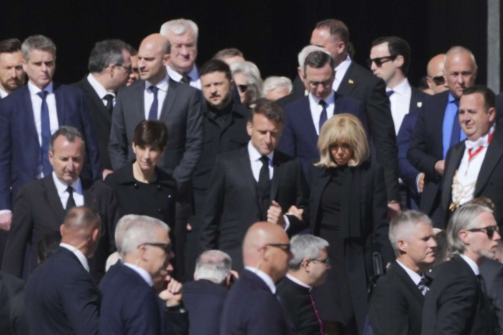 French President Emmanuel Macron, centre, Ukrainian President Volodymr Zelensky, background centre, and other guests arrive for the funeral of Pope Francis in St Peter’s Square at the Vatican (Andrew Medichini/AP)