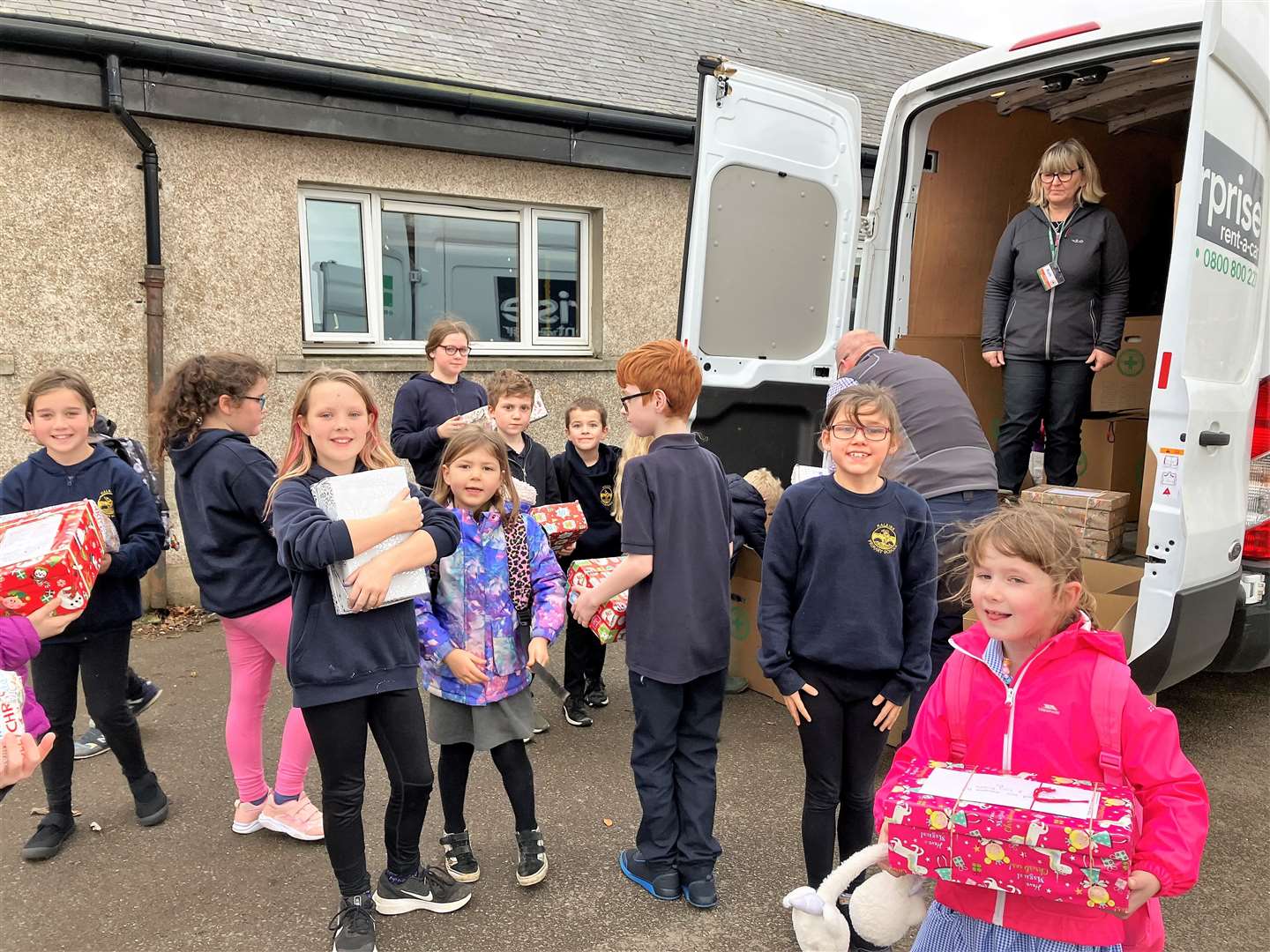 Halkirk kids helped stack the van with the boxes.