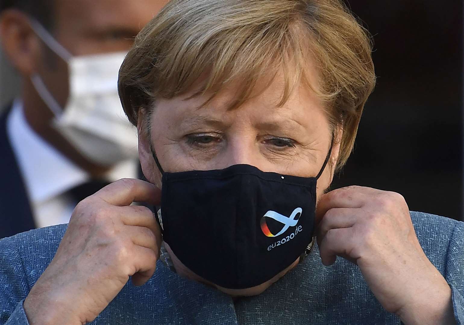 German chancellor Angela Merkel has called for Russian authorities to conduct an investigation into allegations of poisoning of Alexei Navalny (AP)