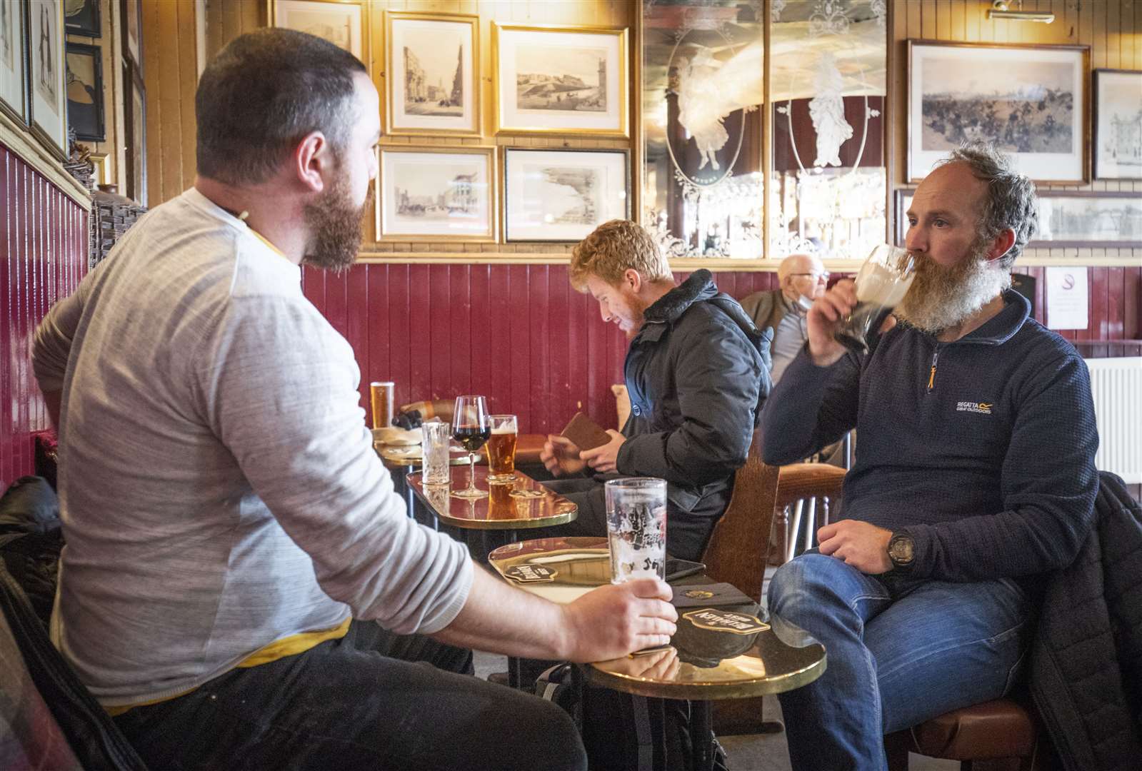 Drinkers in Scotland must be seated after extra Covid measures were introduced on Monday (Jane Barlow/PA)
