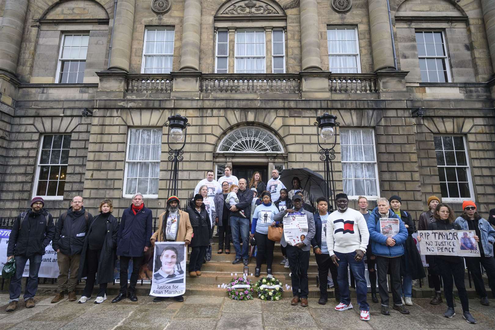 The families and supporters of Sheku Bayoh and Allan Marshall hold a remembrance vigil on the steps of Bute House (John Linton/PA)