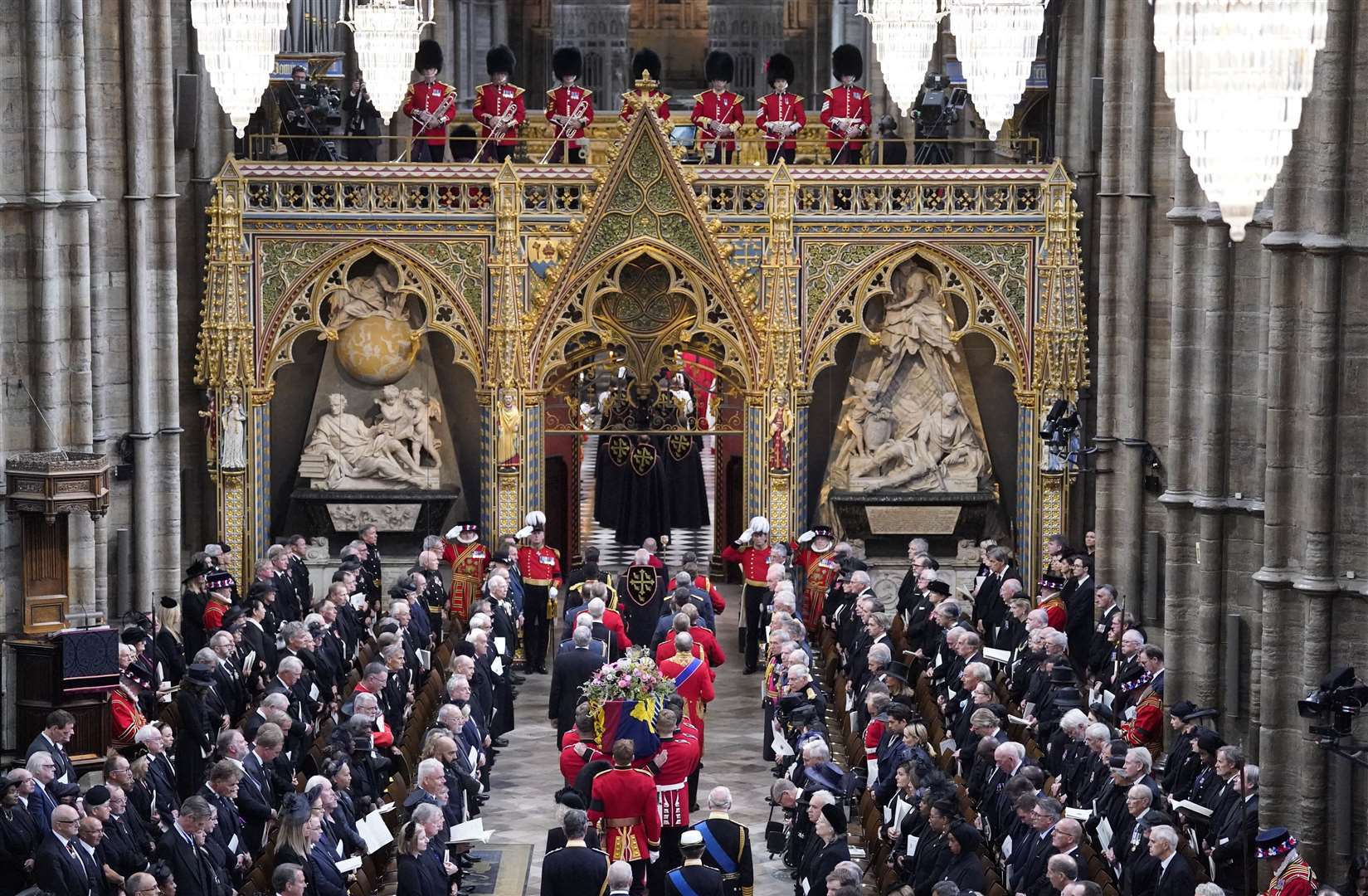 King Charles III and members of the royal family follow behind the coffin of Queen Elizabeth II as it is carried into Westminster Abbey during her state funeral. Picture: PA Rota