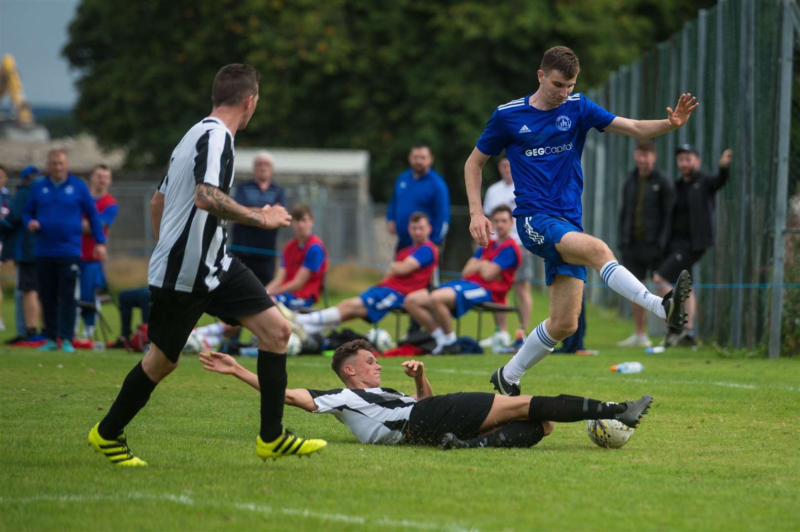 North Caledonian League - Alness United v Invergordon, Dalmore Park, Alness...Invergordon wideman Scott MacIver can't get passed the Alness defence...Picture: Callum Mackay..