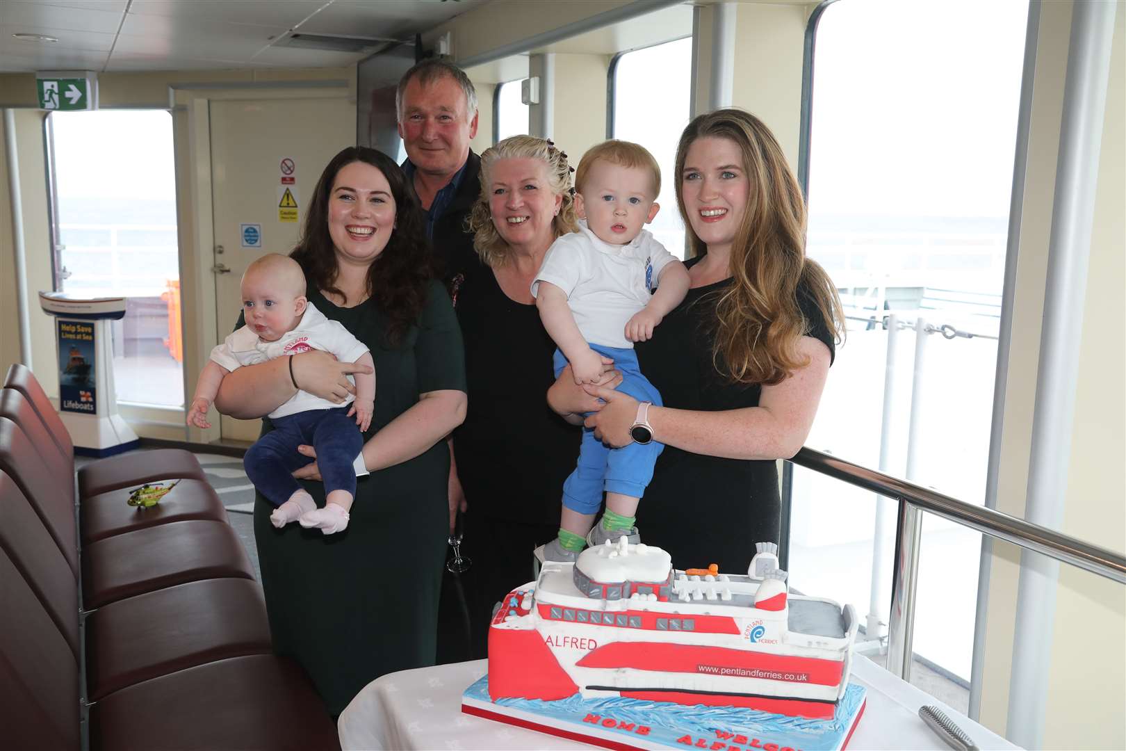 Members of the Banks family with their MV Alfred cake which was cut by Laura Banks. From left: Jess and Jenni Wilson, Andrew Banks, Susan Banks, Eddy and Laura Banks.