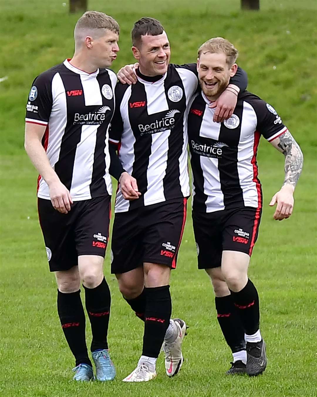 Wick Academy's Ross Allan and Alan Hughes celebrate with goalscorer Gordon MacNab. Picture: Mel Roger