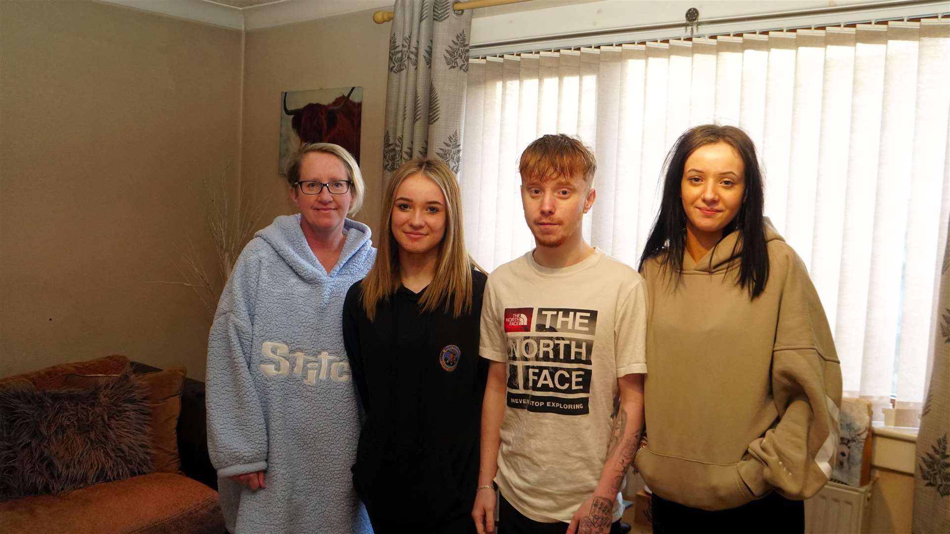 Donna Hill with daughter Olivia next to her and other daughter Holly with partner Kyle. The family is without heating and hot water after losing all their oil to thieves. Picture: DGS