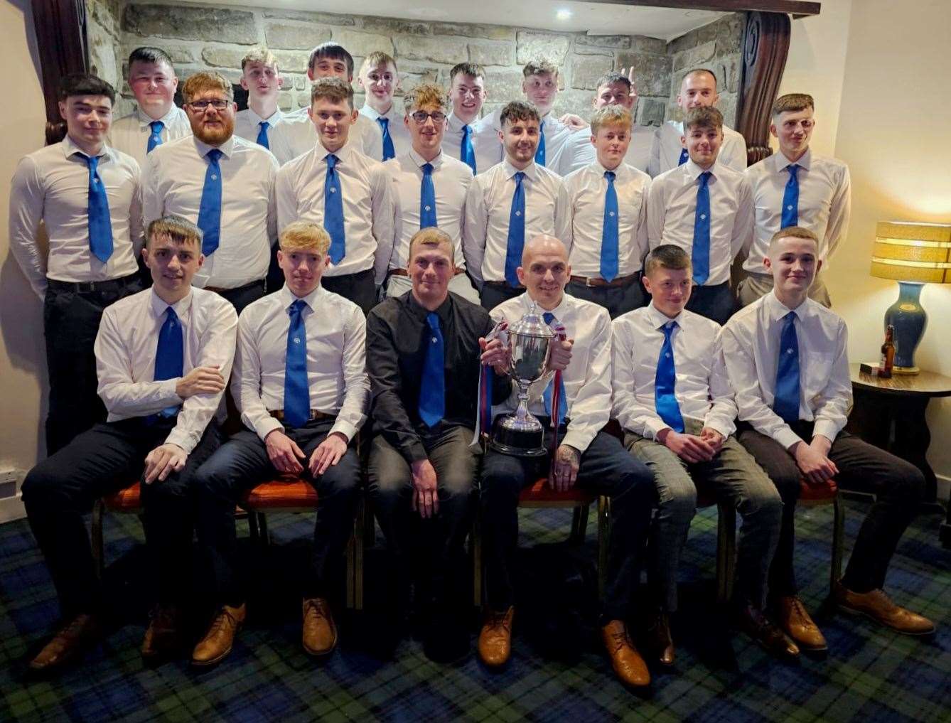 The Keiss squad at their end-of-season presentation night with the CAFA Division Two trophy. Picture: Angus Mackay
