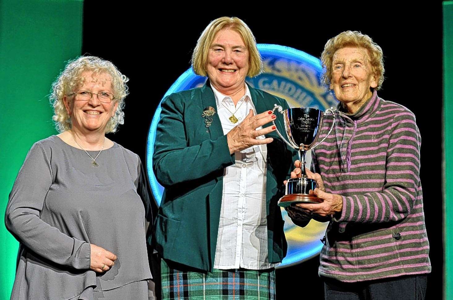 In 2015 the Edinburgh Caithness Association donated a trophy at the Royal National Mod in Oban in memory of past president John Lockie. The John Lockie Trophy would be awarded annually in the rural choirs category for the highest Gaelic mark across three choral competitions, and was won that year by Mull Gaelic Choir. His widow, Mary, presented the trophy to Elizabeth Jack, conductor of the Mull choir, and Janet Macdonald, Gaelic tutor. Picture: Graham Hood Photography