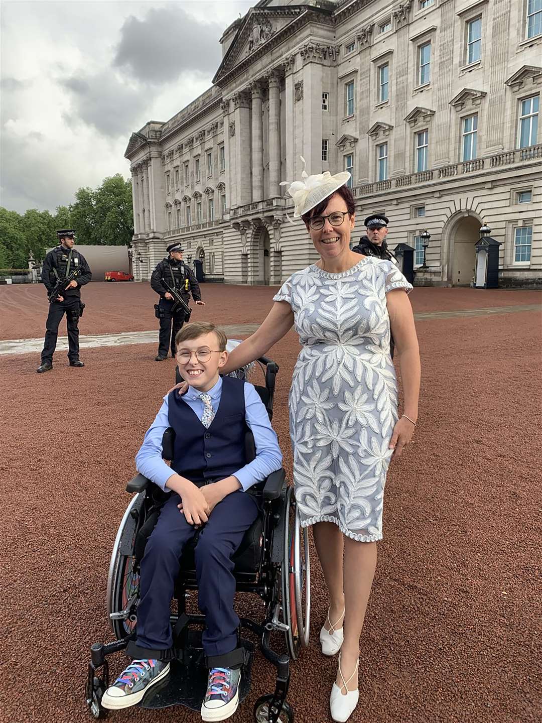 Tobias Weller, 11, and his mother, Ruth Garbutt, met the Princess Royal, the Prince of Wales and the Duchess of Cornwall at a garden party at Buckingham Palace (Family handout/PA)