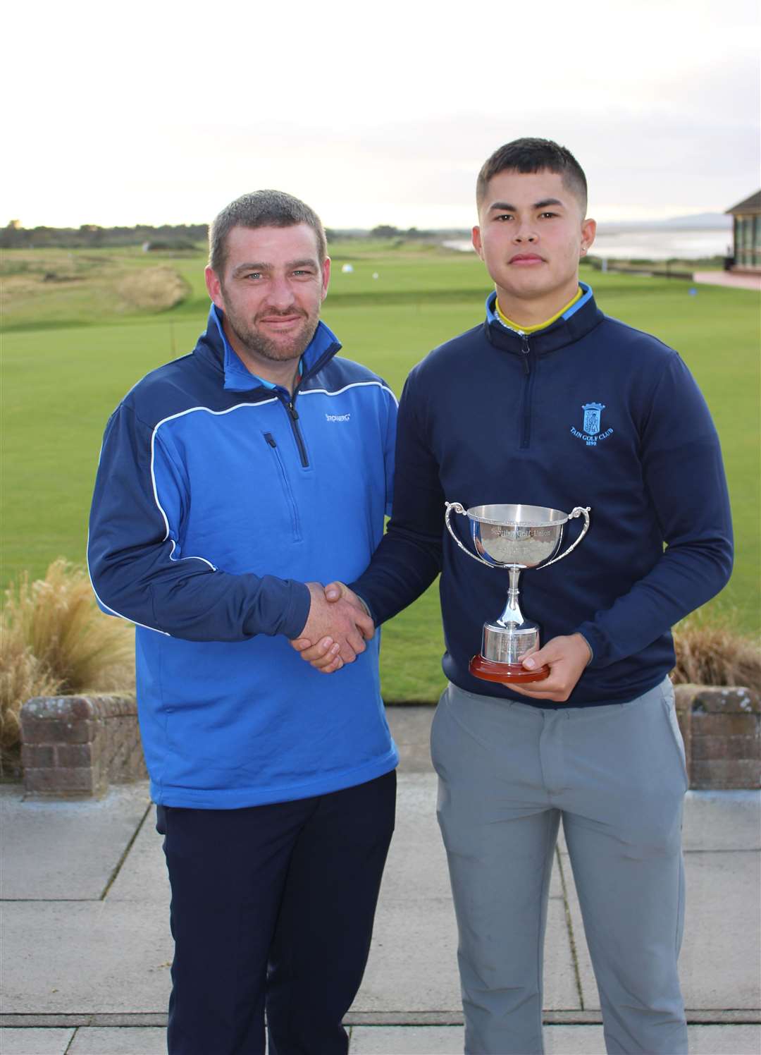 Dougie Thorburn congratulates Sean Kennedy as winner of the Robin Thomson Cup at Nairn.