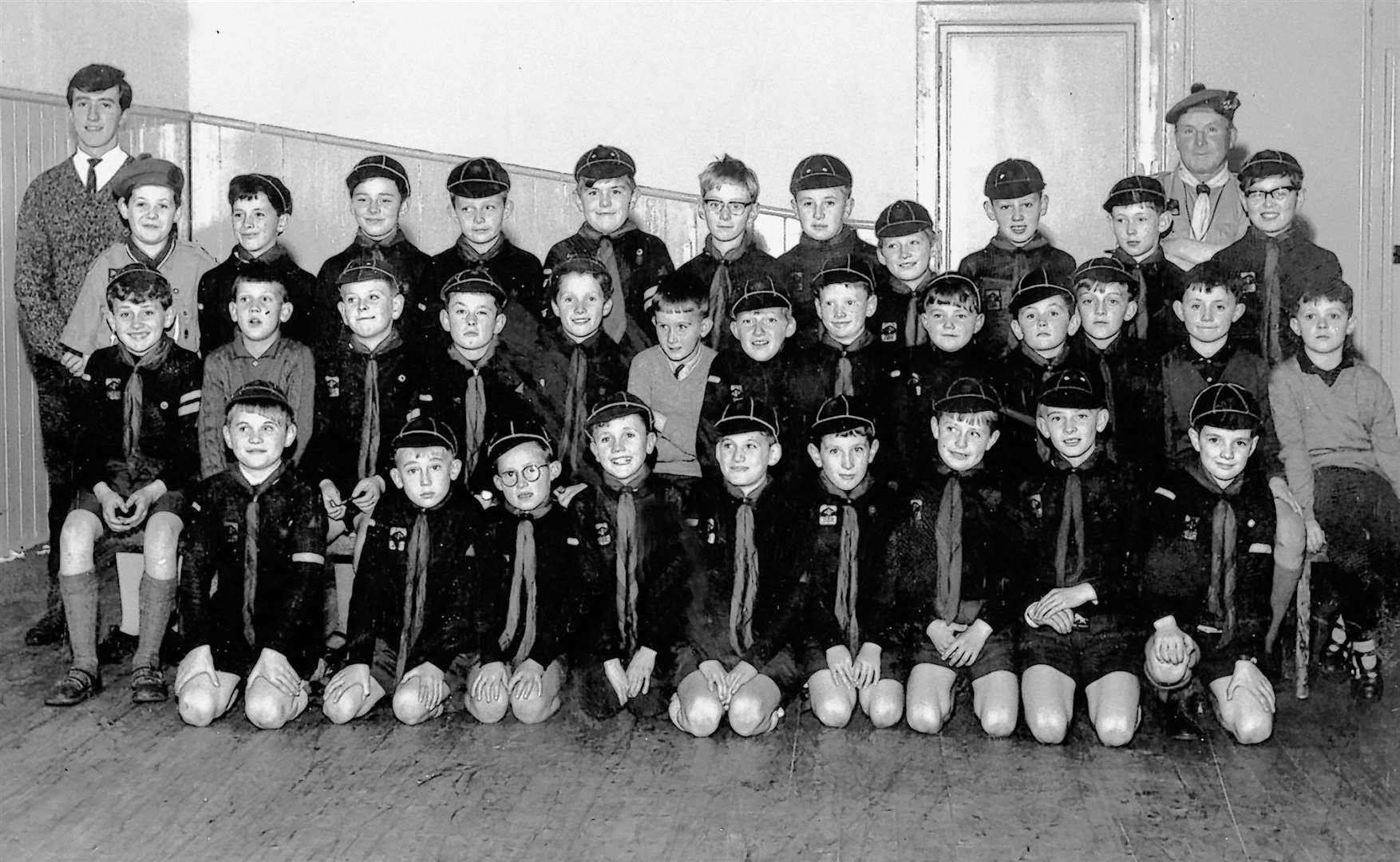 A line-up of Wick Cubs along with their leaders. The picture is thought to have been taken around 1964.