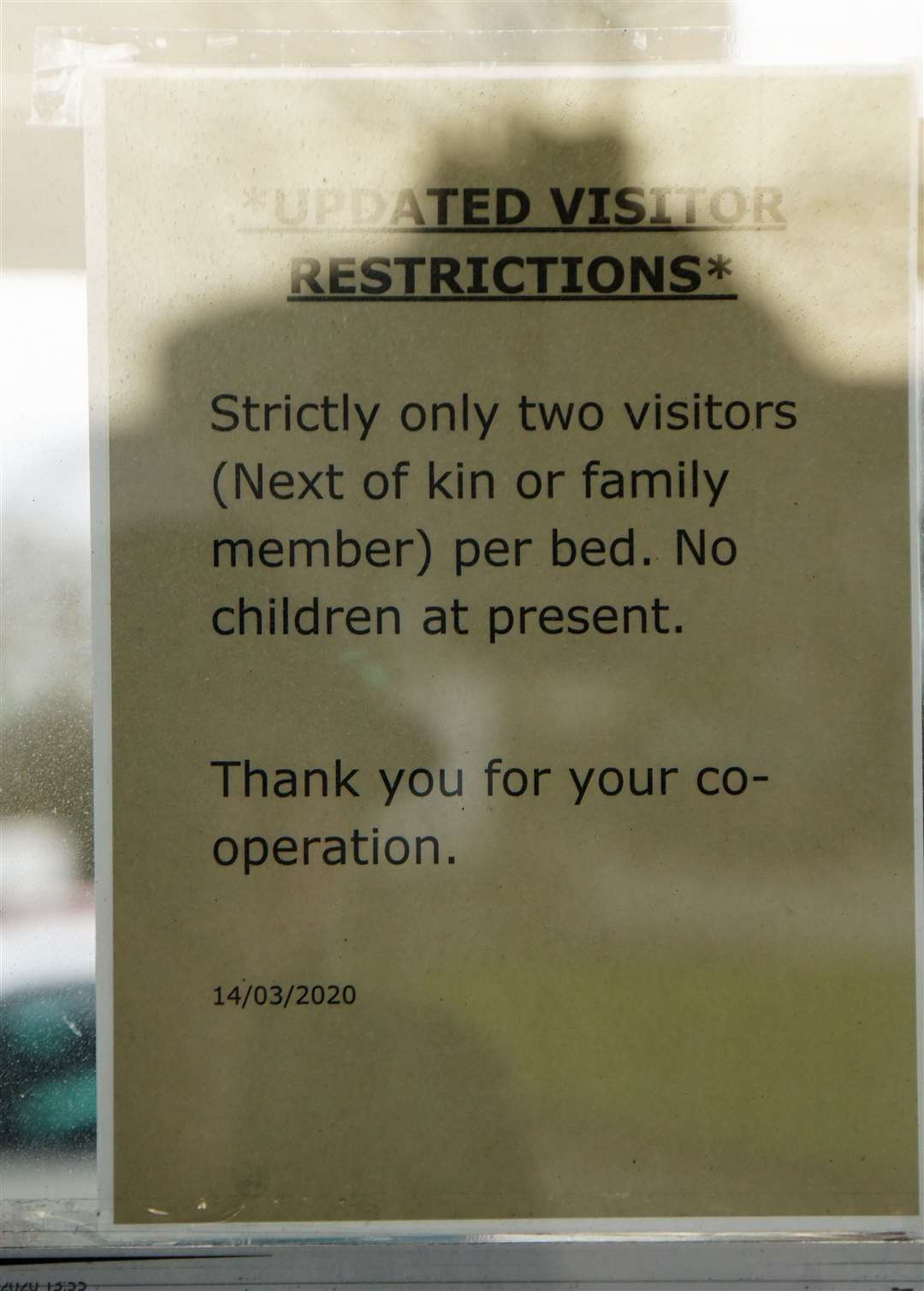 Restrictions on visitors posted on the door of Caithness General Hospital.