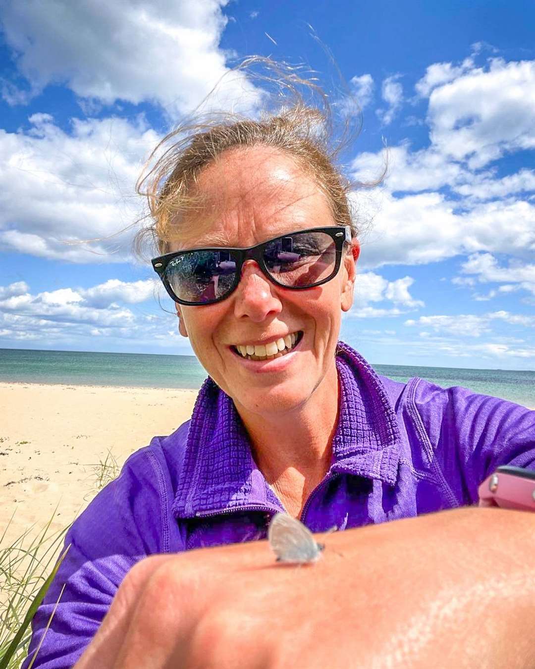 Tracy Munro with a small blue at Dornoch Beach.