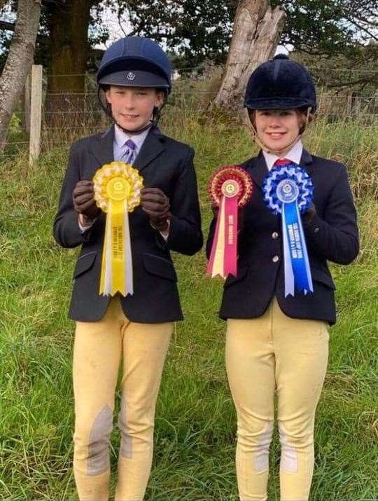 Erin Hewitson (left) and Leoni Kennedy proudly show off their rosettes.