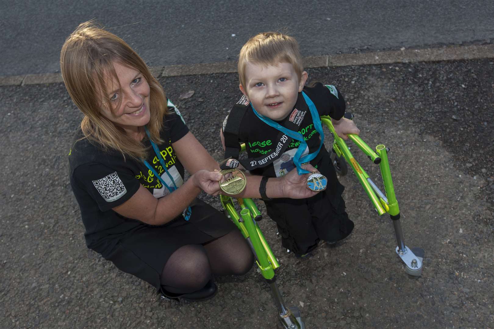 In September 2015, Kayden Malcolm got his first medal when endurance athlete Lorna Stanger presented him with the one she received at the Aviemore Half Marathon. On Sunday, Kayden received his first medal in his own right when he took part in the Mey Mile. Picture: Robert MacDonald / Northern Studios
