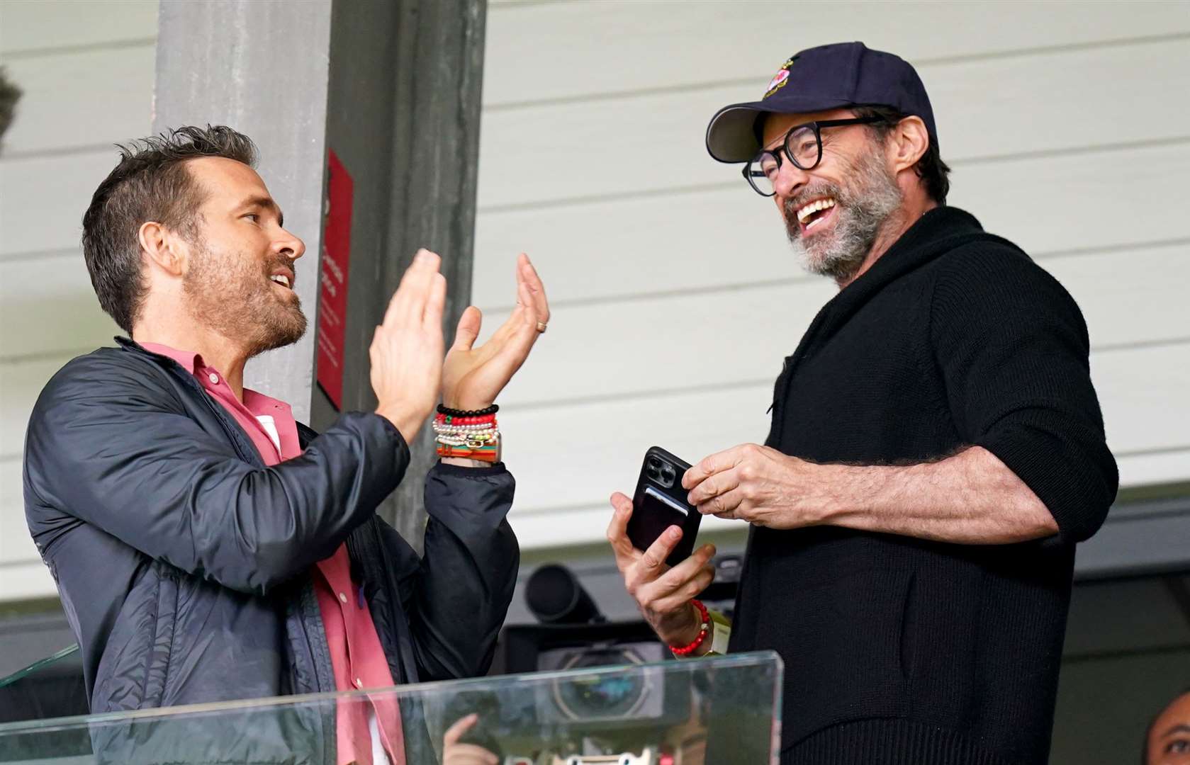 Wrexham co-owner Ryan Reynolds and Hugh Jackman in the stands before a League Two match (Jacob King/PA)