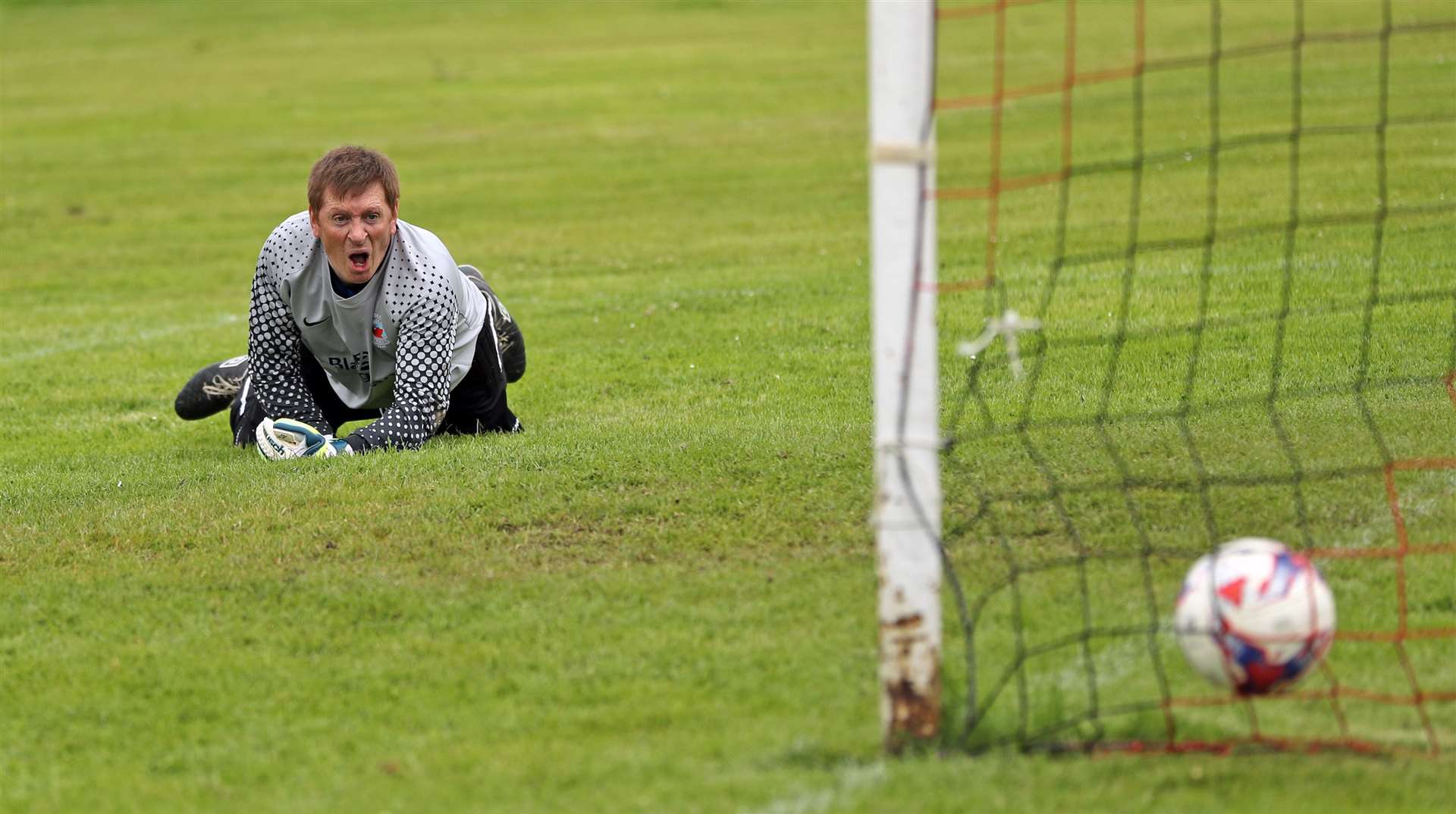 Pentland United boss – and stand-in goalkeeper – Michael Gray looks on in anguish as Wick Groats' opener creeps into the net. Picture: James Gunn