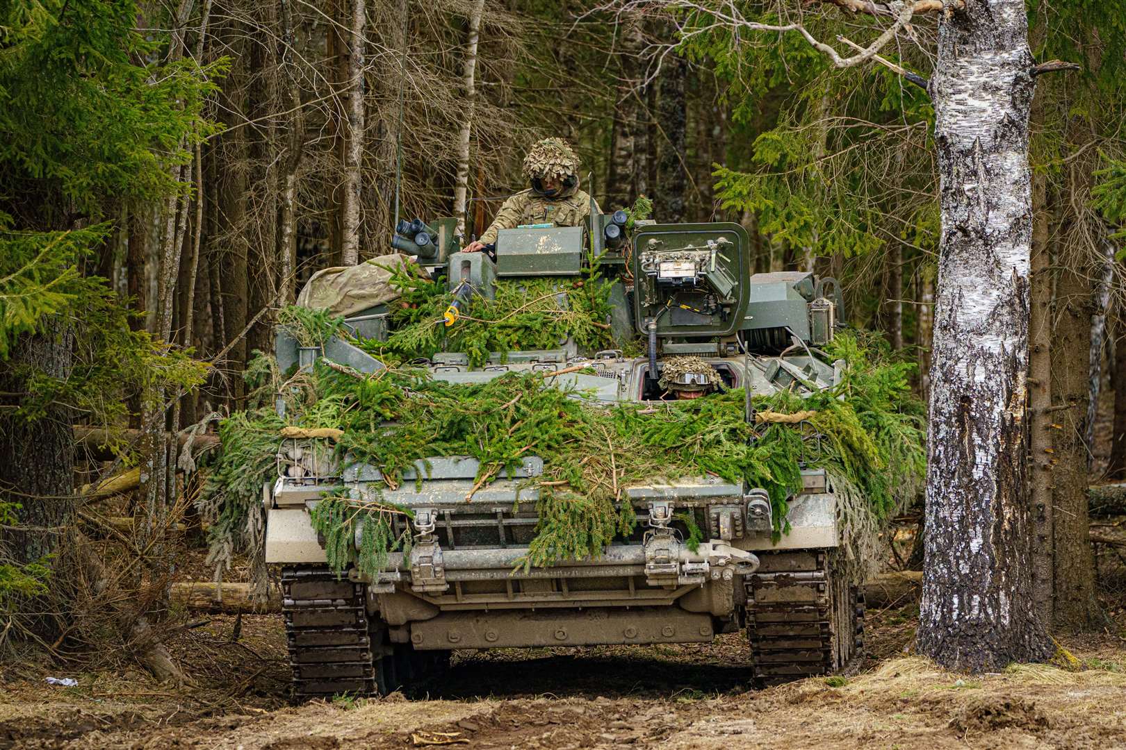 British soldiers on manoeuvres in the Tapa central military training area in Estonia during a Nato exercise (Ben Birchall/PA)