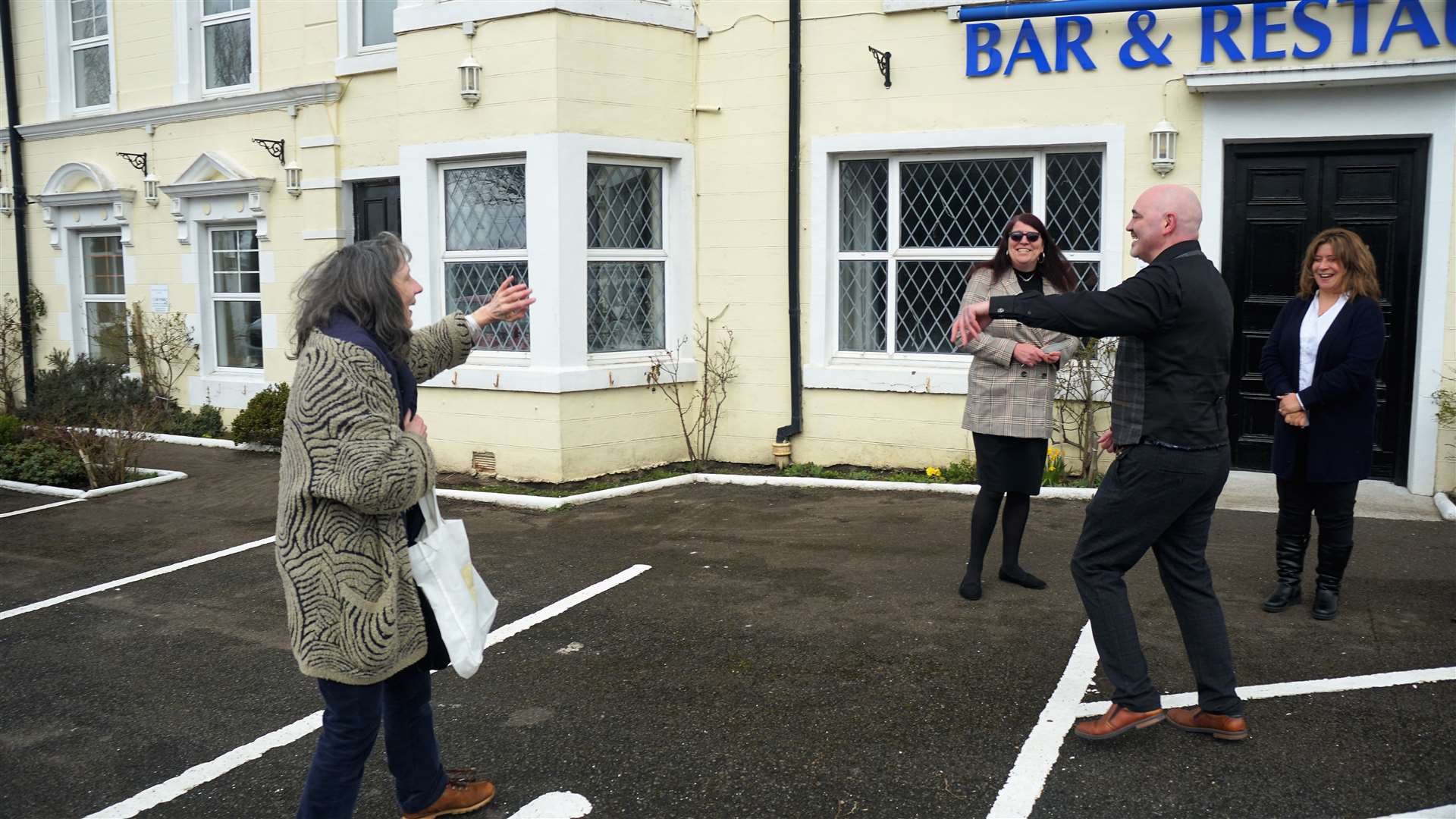 A local well-wisher bids farewell to former owners Steven and Sharn outside the Portland Hotel. Picture: DGS