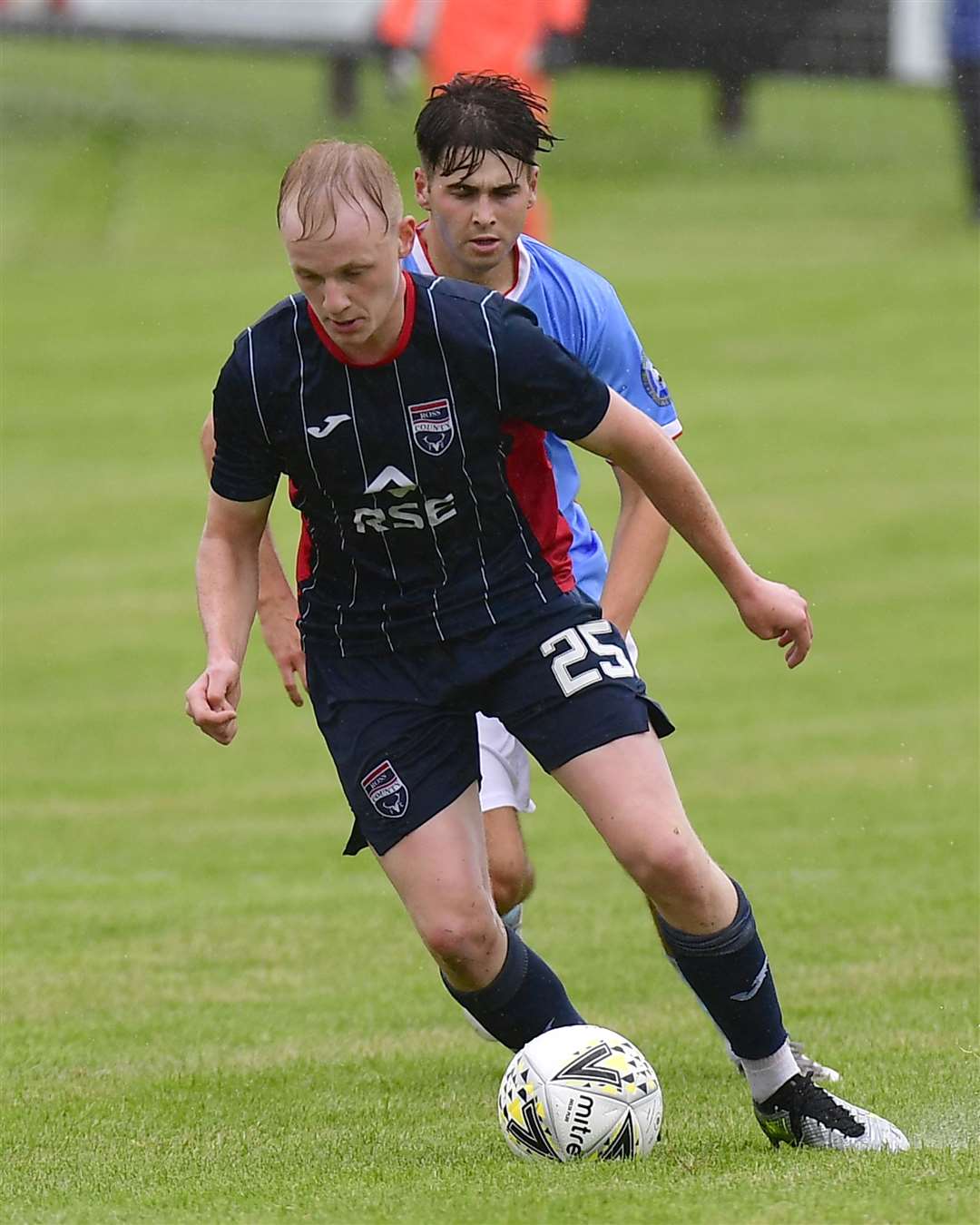 Ross County's Ethan Kevill and Wick's Gary Pullen at Harmsworth Park in July this year. Picture: Mel Roger