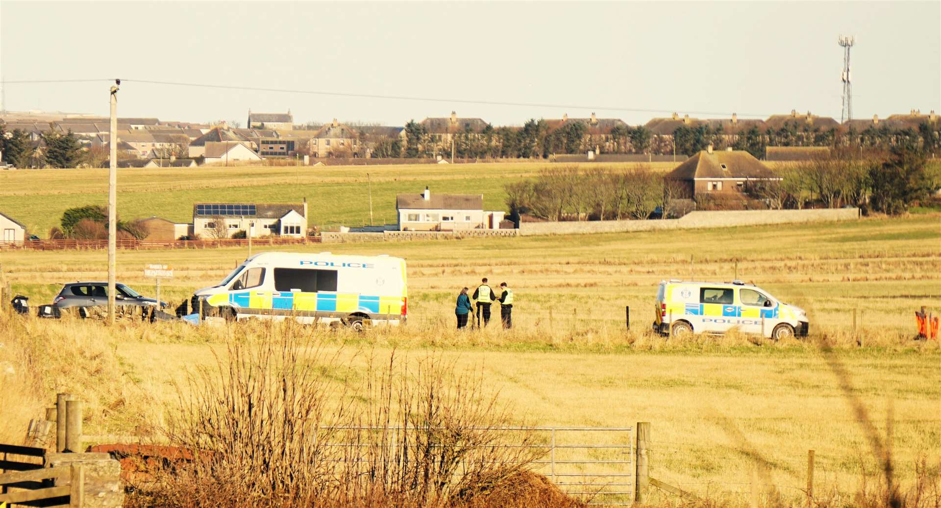 A woman was seen talking to police officers on the road leading to the farm at around 1pm today. Picture: DGS