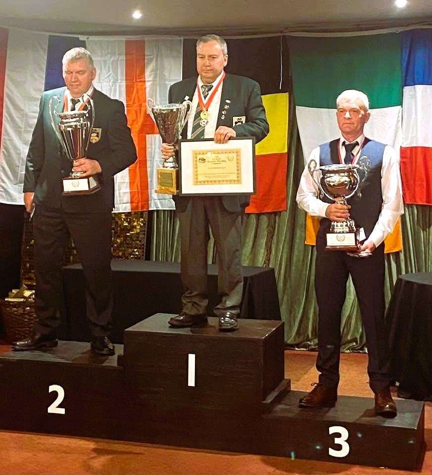 James Tait stands on the third position plinth for the Sunday night presentation of prizes. Dan Donnelly and John Whelan secured first and second places respectively. James received a cup and bronze medal for third. Picture supplied