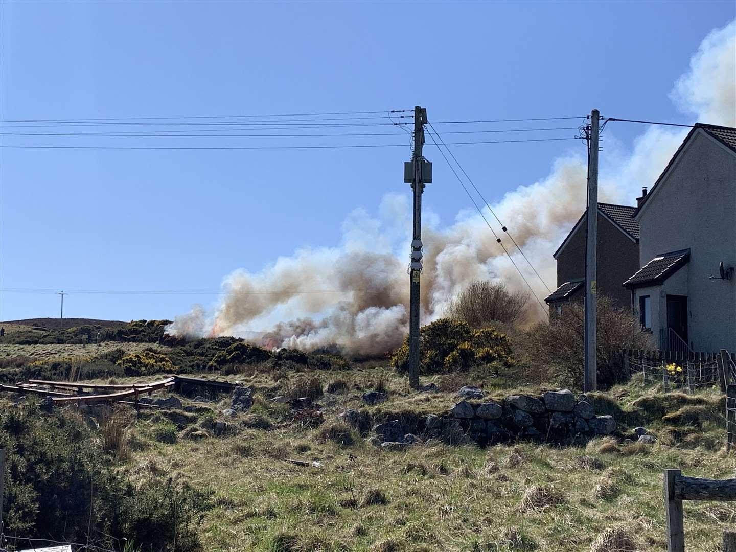 Smoke billowing close to houses at Melvich. Picture: Struan Mackie